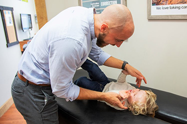 Chiropractor Frederick MD Adam Smith Child Adjustment