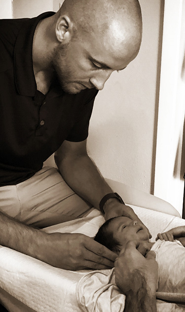 Chiropractor Frederick MD Adam Smith Infant Adjustment