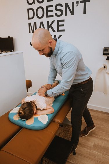 Chiropractor Frederick MD Adam Smith Adjusting Boy