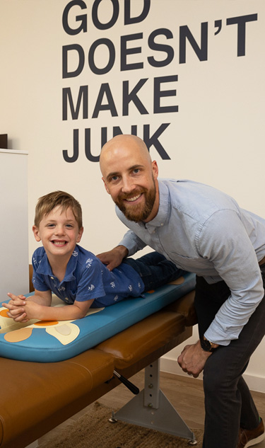 Chiropractor Frederick MD Adam Smith Adjusting Child