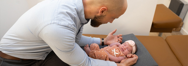 Chiropractor Frederick MD Adam Smith Adjusting Infant